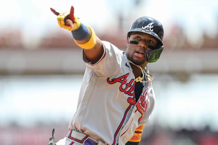 Jun 27, 2021; Cincinnati, Ohio, USA; Atlanta Braves right fielder Ronald Acuna Jr. (13) reacts after hitting a home run against the Cincinnati Reds in the fifth inning at Great American Ball Park.